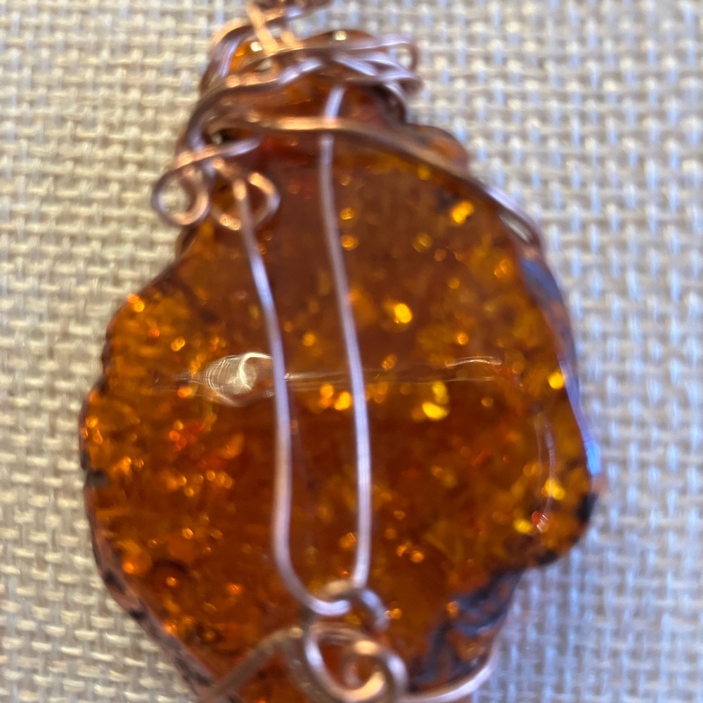 WIRE WRAPPED PENDANT WITH Copper wire on a black cord